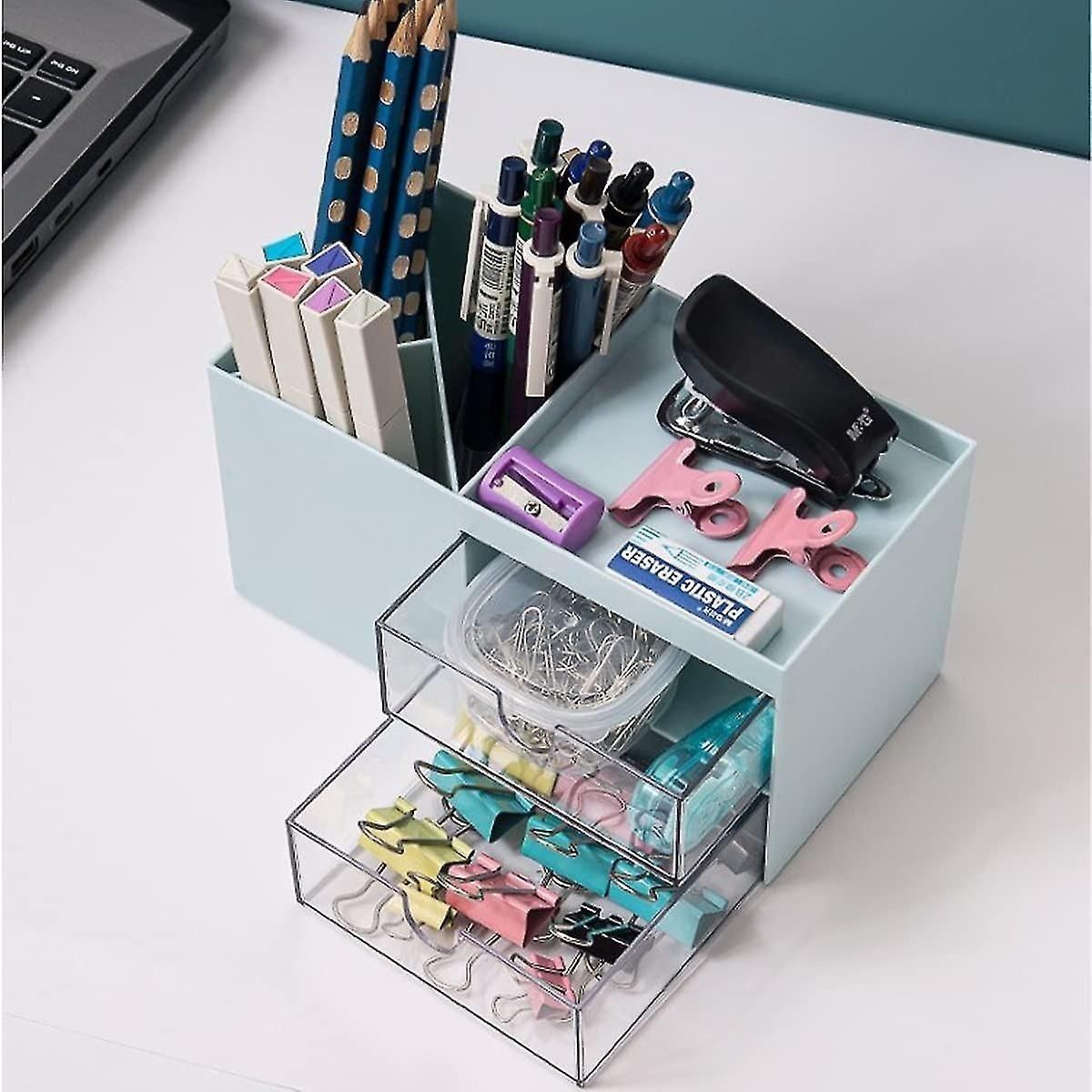 Desk organizer with stationery items on a white surface